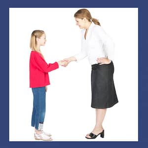 teacher shaking child's hand